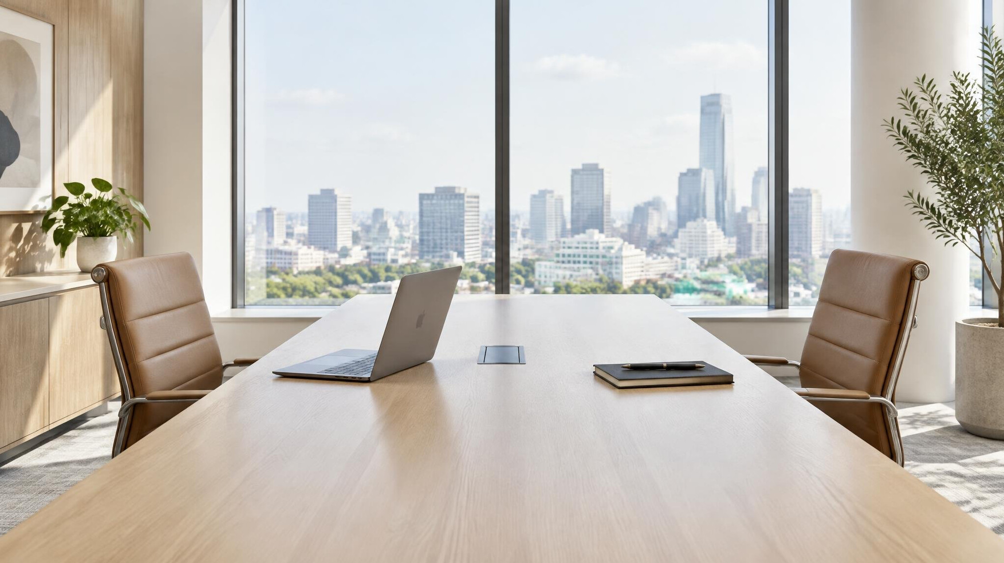 Empty modern boardroom with a long wooden table and two chairs facing each other in daylight